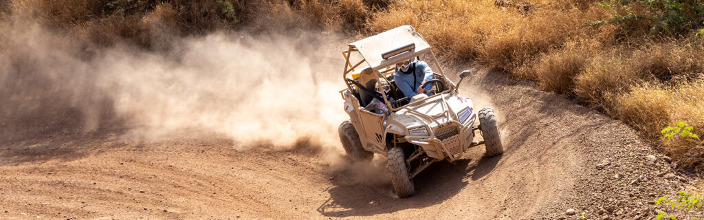 ATV kicking up dust at Coral Crater in Oahu Hawaii