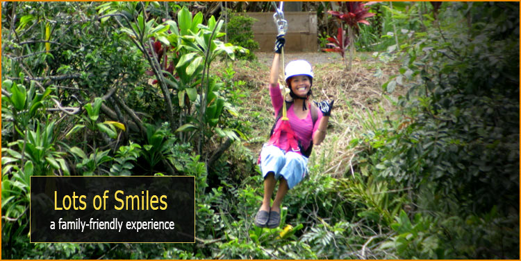 Smiling child enjoying the zipline at Botanical World Adventures